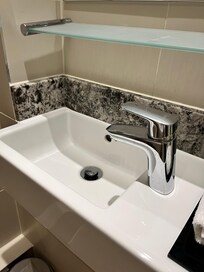Tiny sink. With shelf, Impossible to brush your teeth!