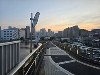 Evening view of skyline along Shiokaze Bridge.