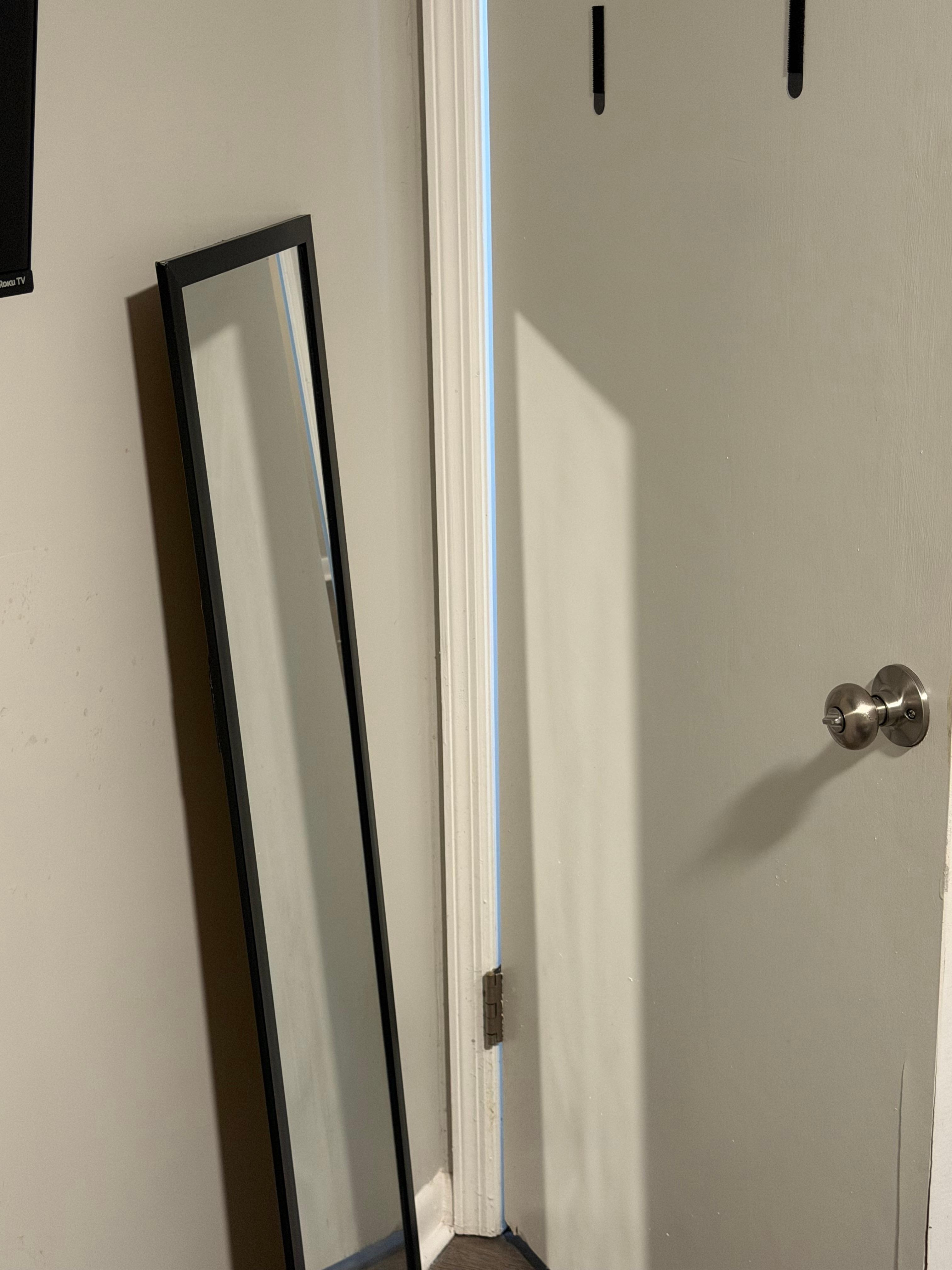 Mirror dismounted and laying against the wall