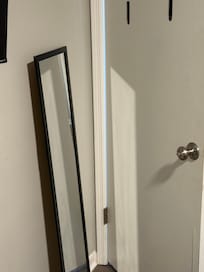 Mirror dismounted and laying against the wall