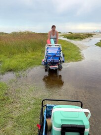The path to the beach floods after a heavy rain storm.