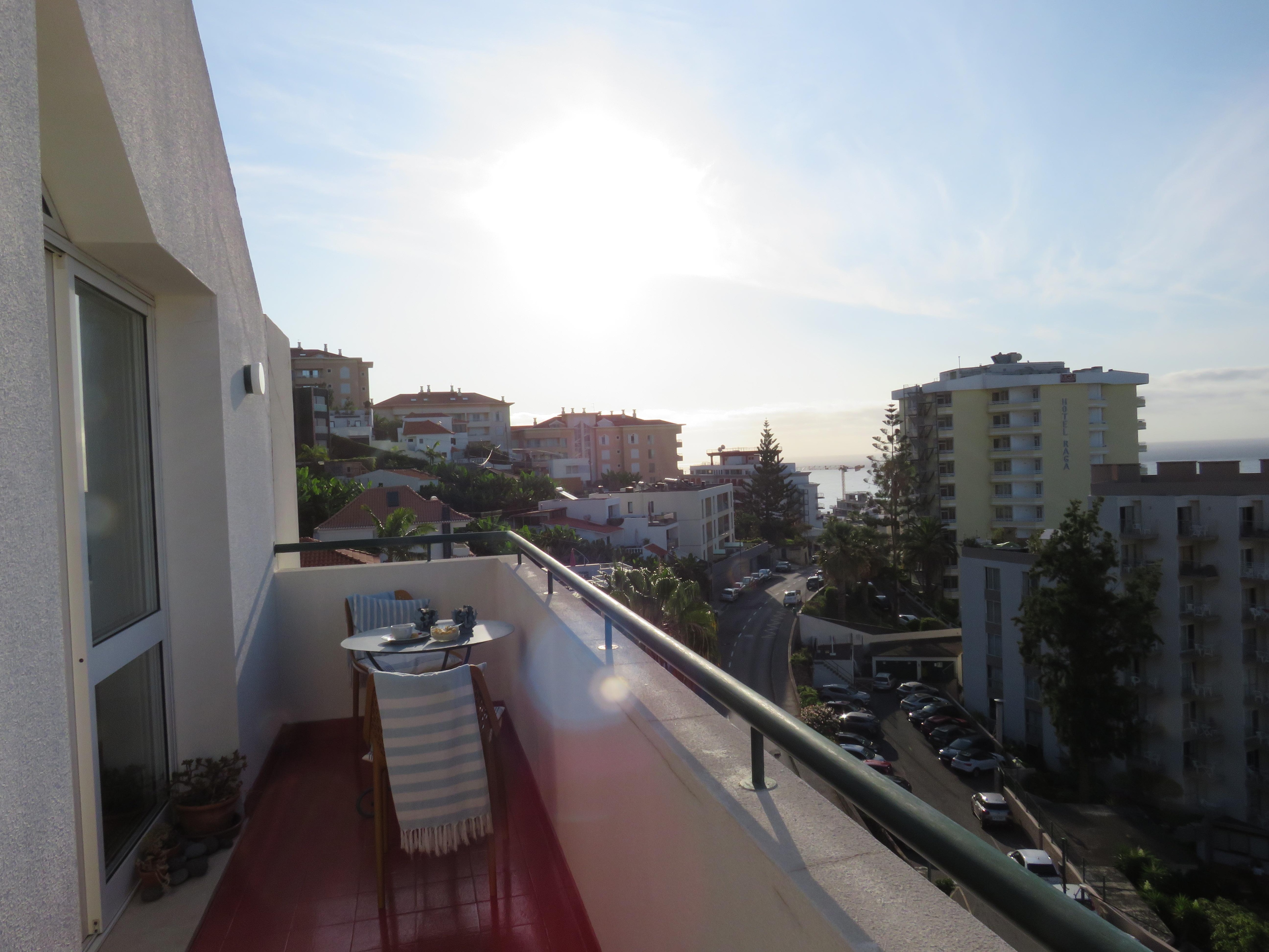 The balcony had ample room for sitting, viewing, people watching on the street below.