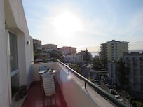 The balcony had ample room for sitting, viewing, people watching on the street below.