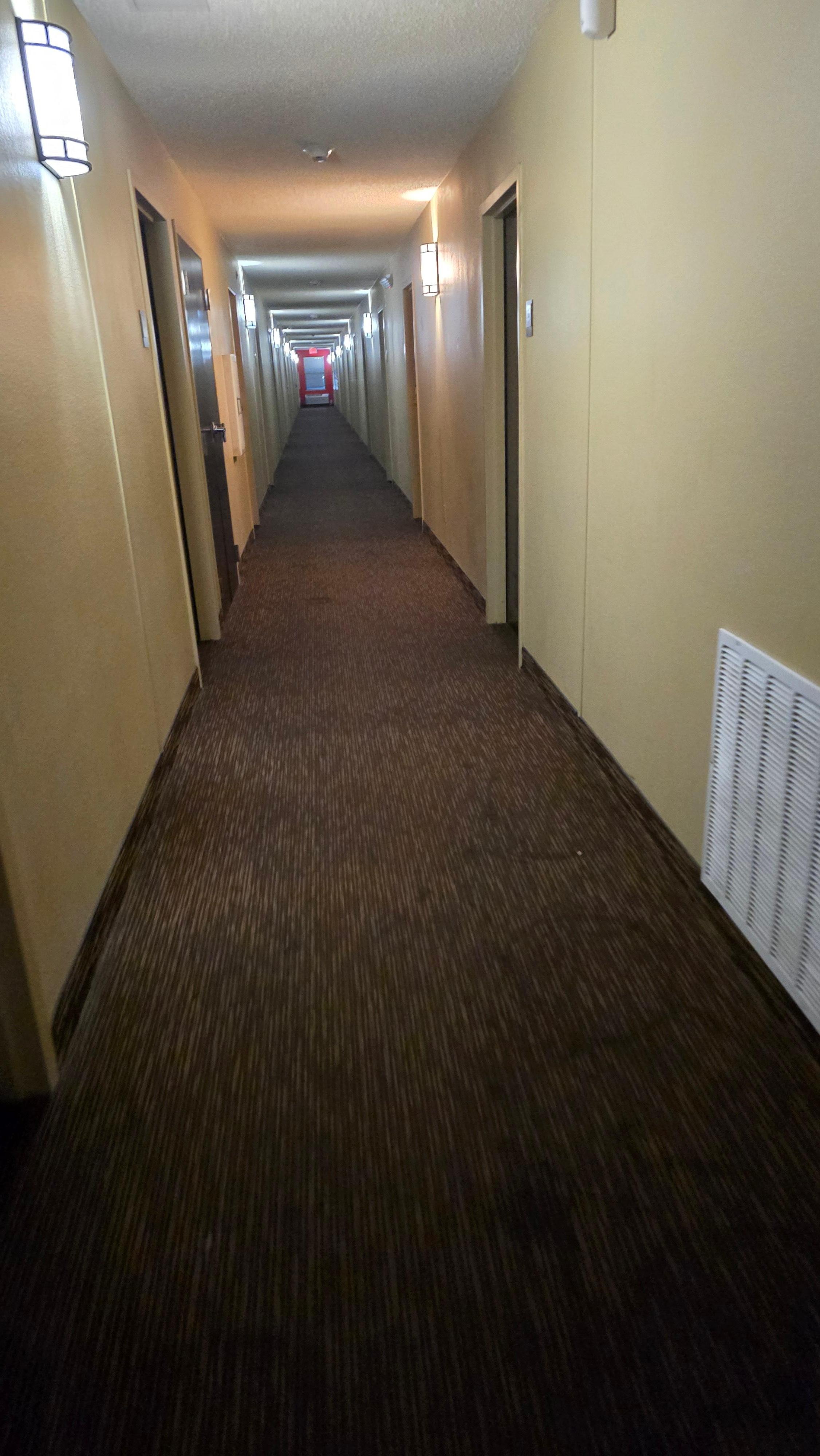 This is dimmed gloomy hallway, just hava a good phone camera... hallway is smelly too [smoke smell)