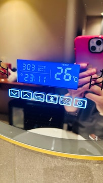 Digital panels with annoying blue light on mirror which cannot be switched off.