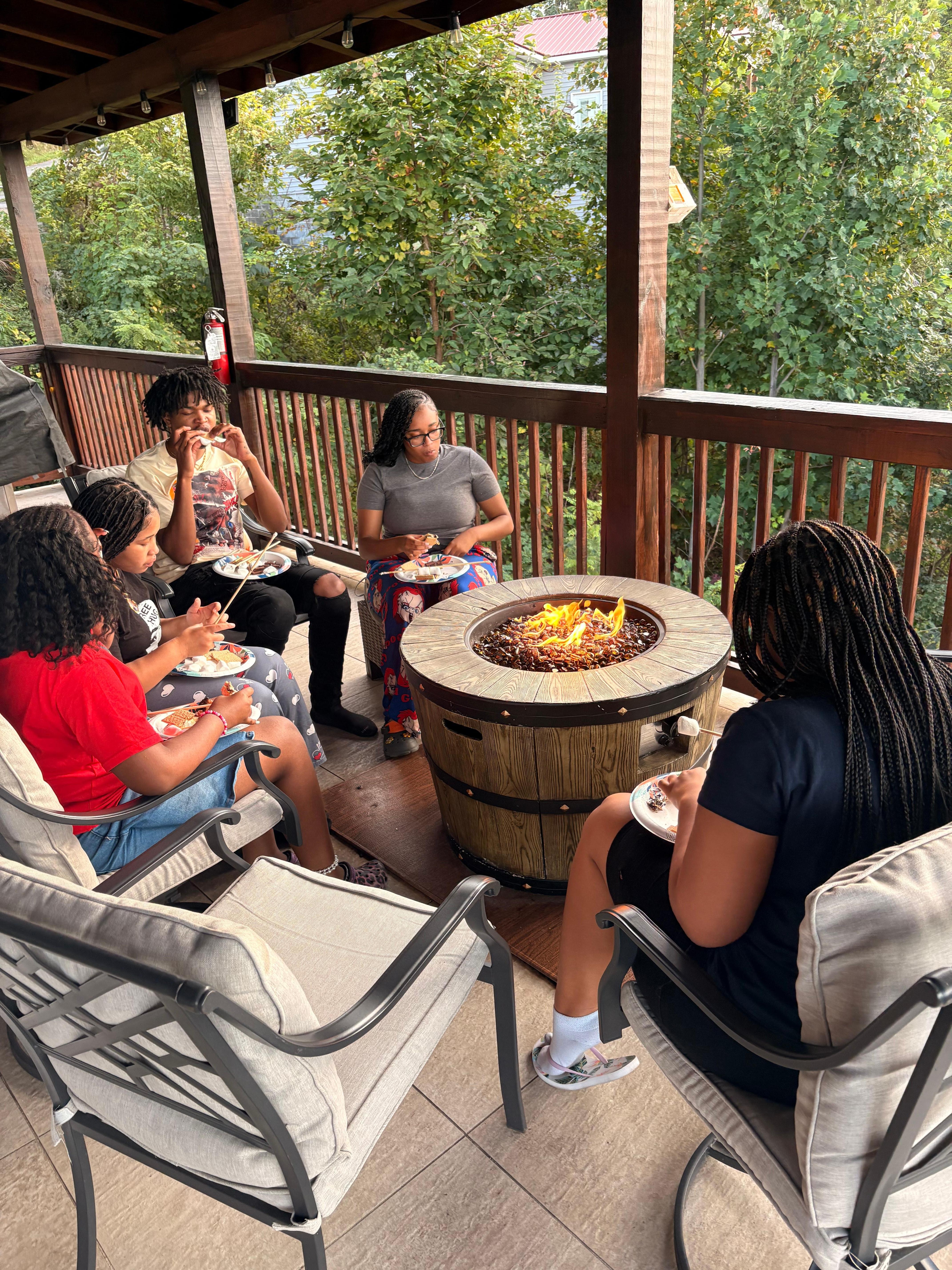 Sitting out on the deck with my family roasting smores. 