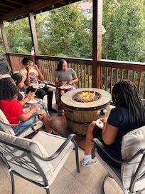 Sitting out on the deck with my family roasting smores.