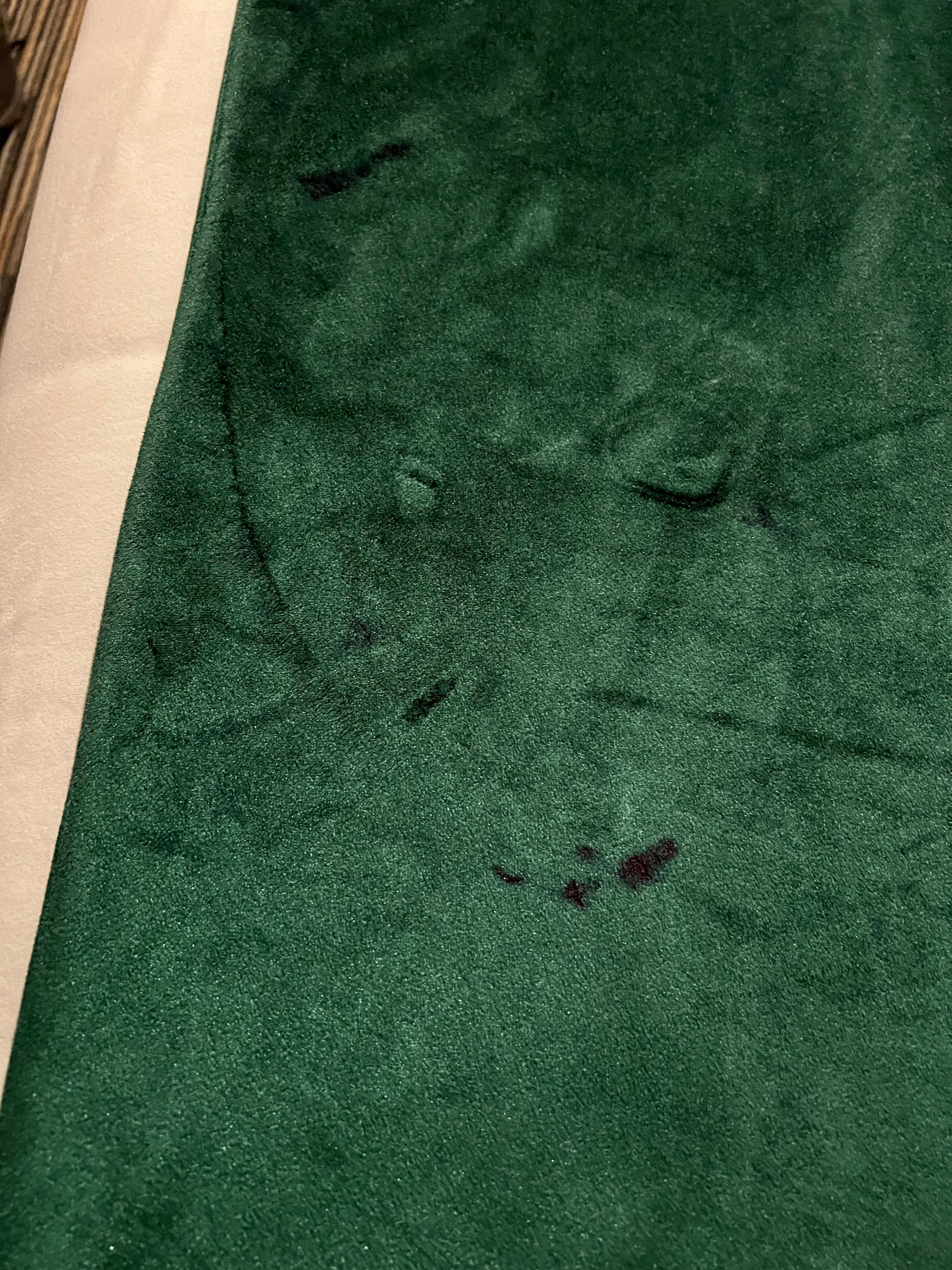 Odd red stains on bed coverings