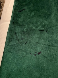 Odd red stains on bed coverings