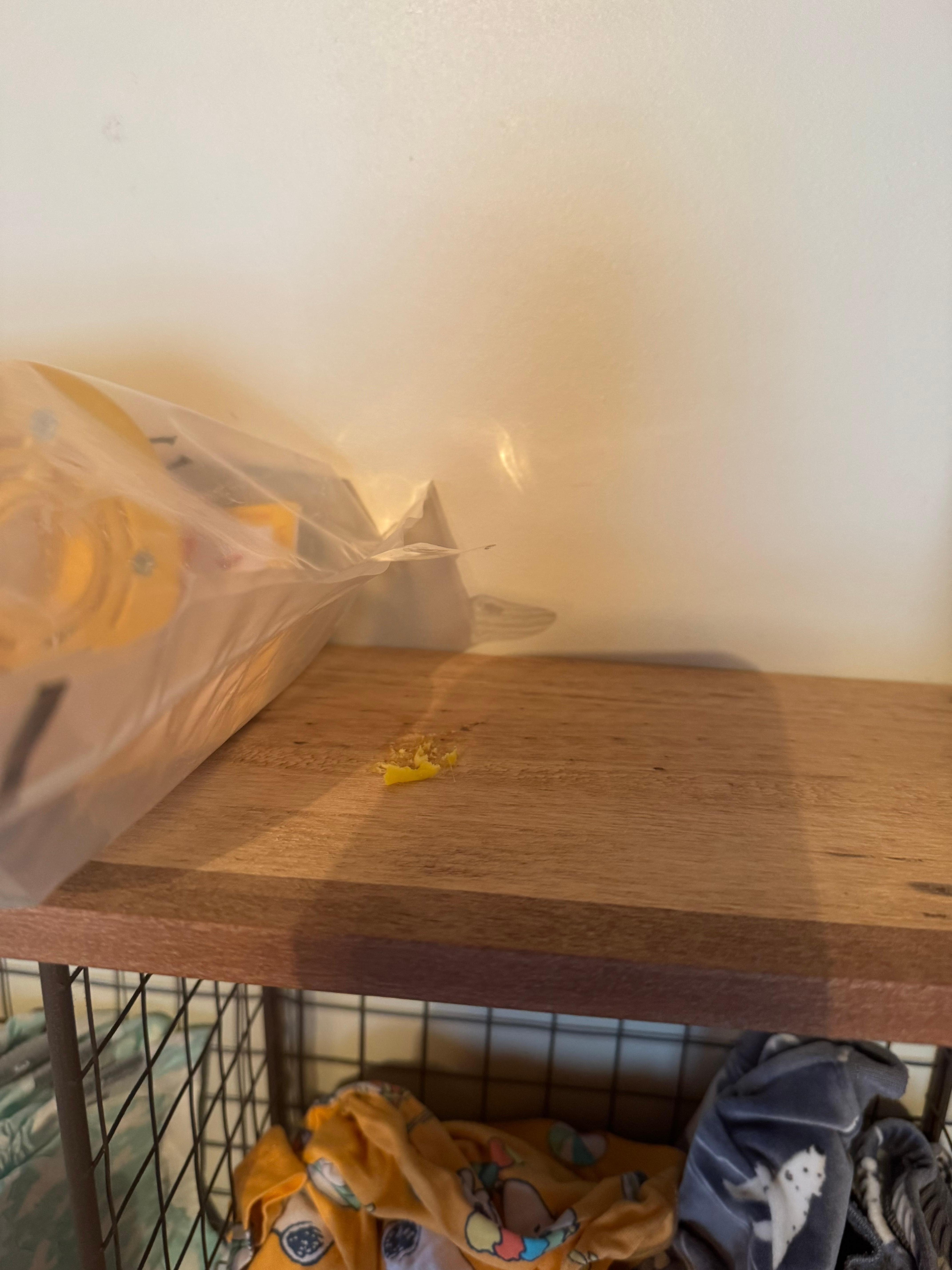 Gum or something on top of the shelf for clothes storage. 