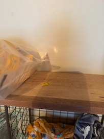 Gum or something on top of the shelf for clothes storage.