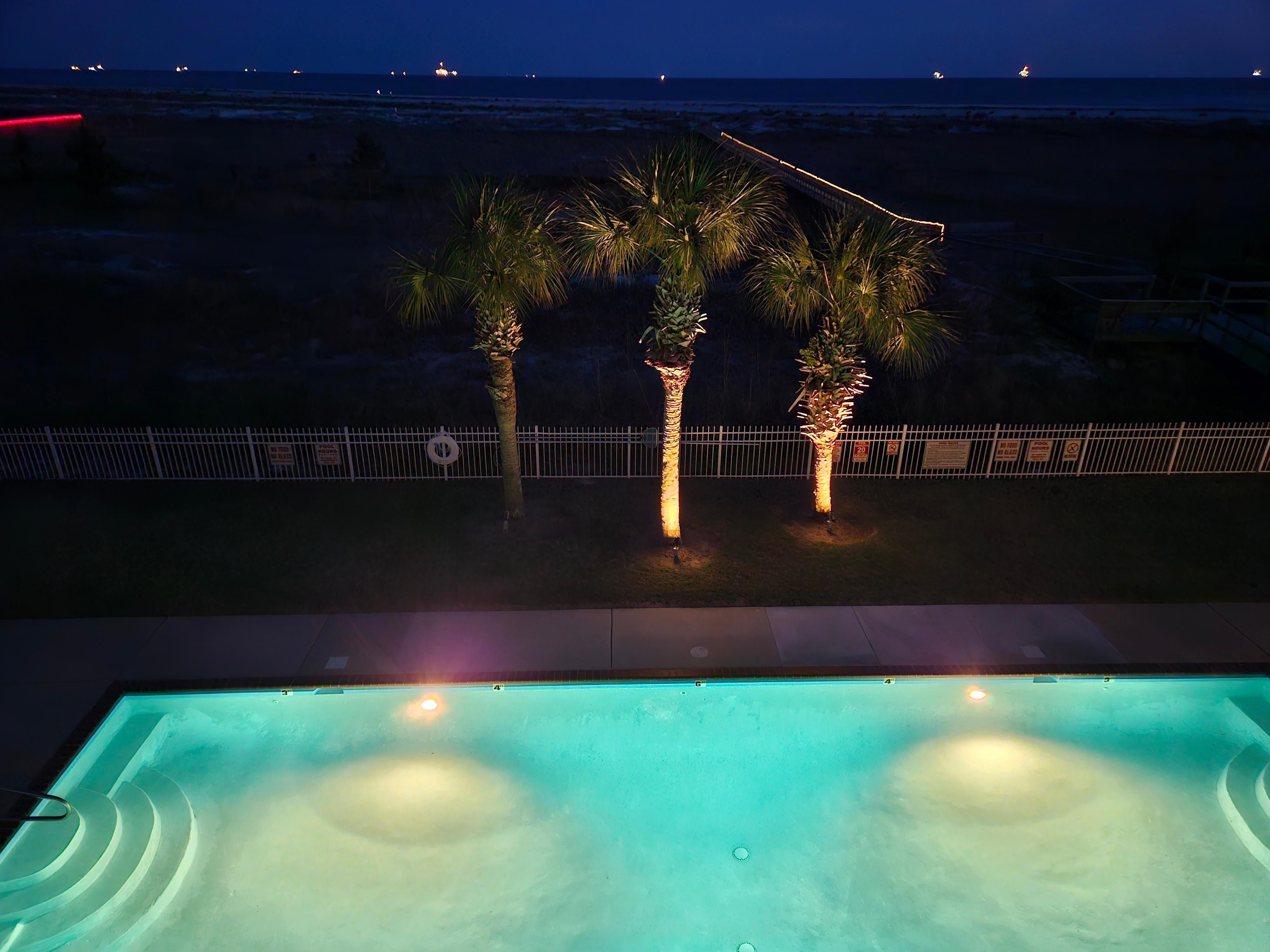 Nighttime view of pool and beach. 
