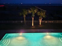 Nighttime view of pool and beach.