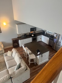 View of family area from stairs going up to the second floor.