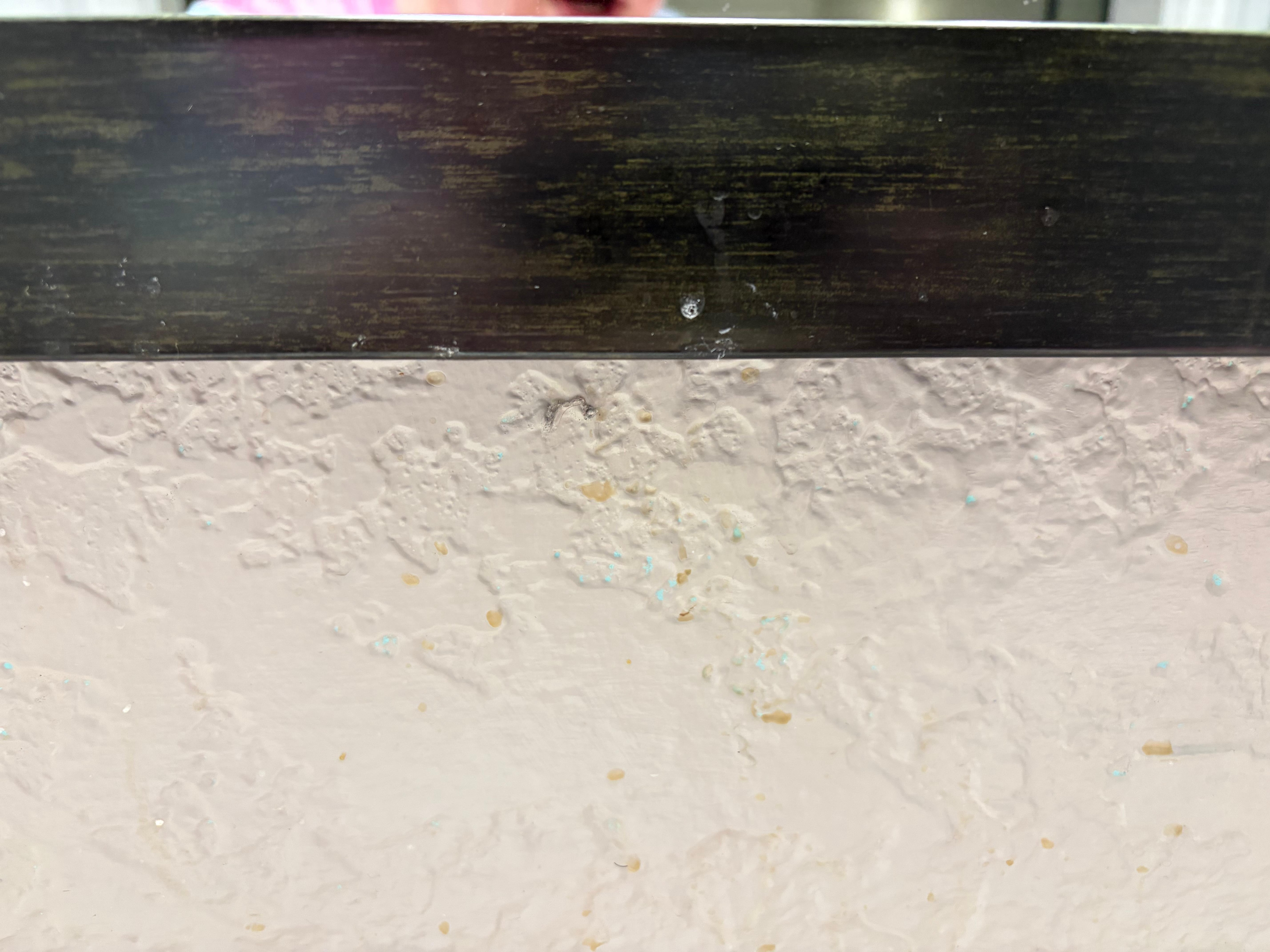 Toothpaste and coffee splatters all over the walls