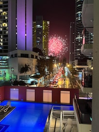 The pool lit up by New Year’s Eve fireworks