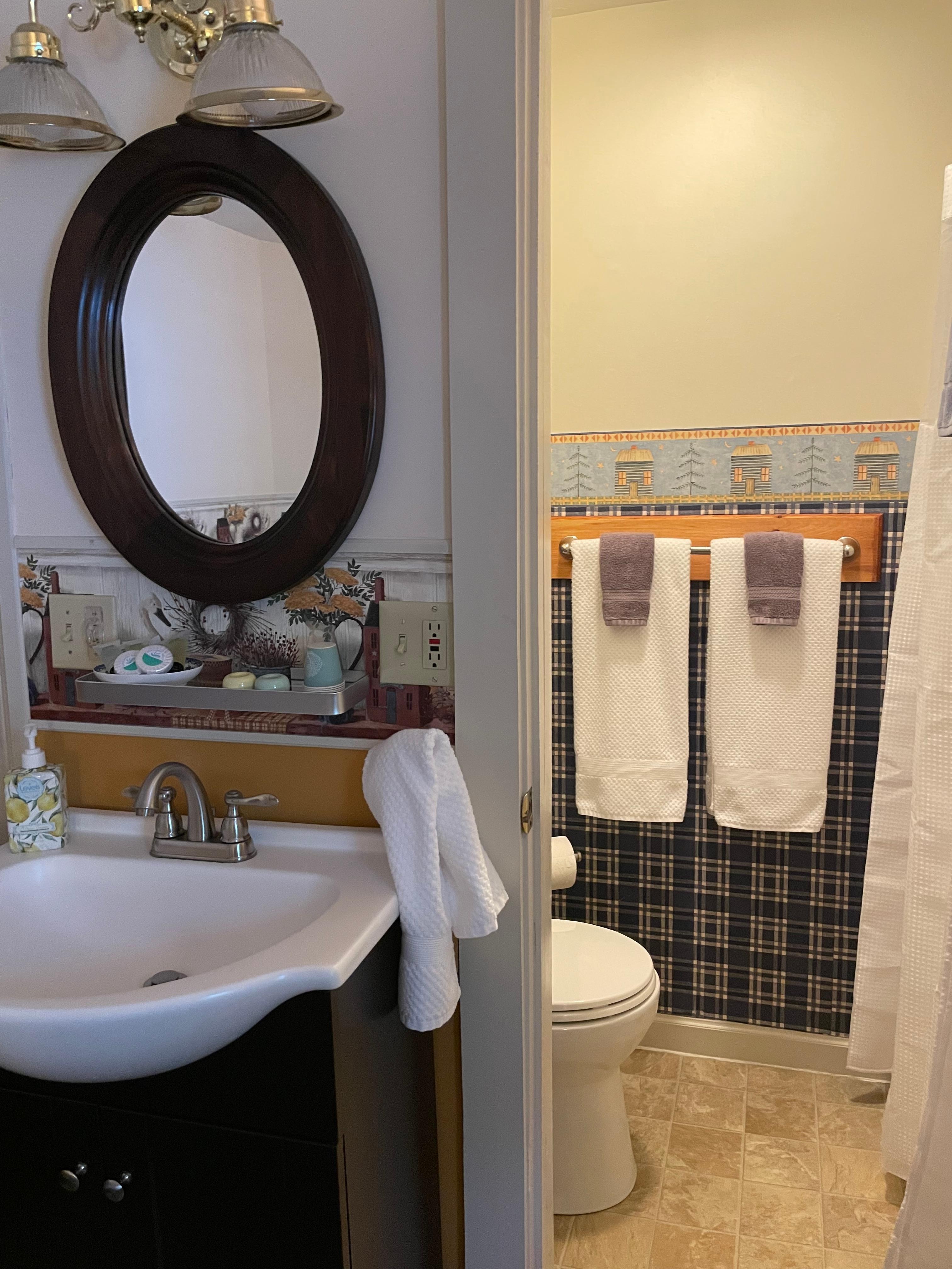 Compact bathroom with shower was very clean and updated