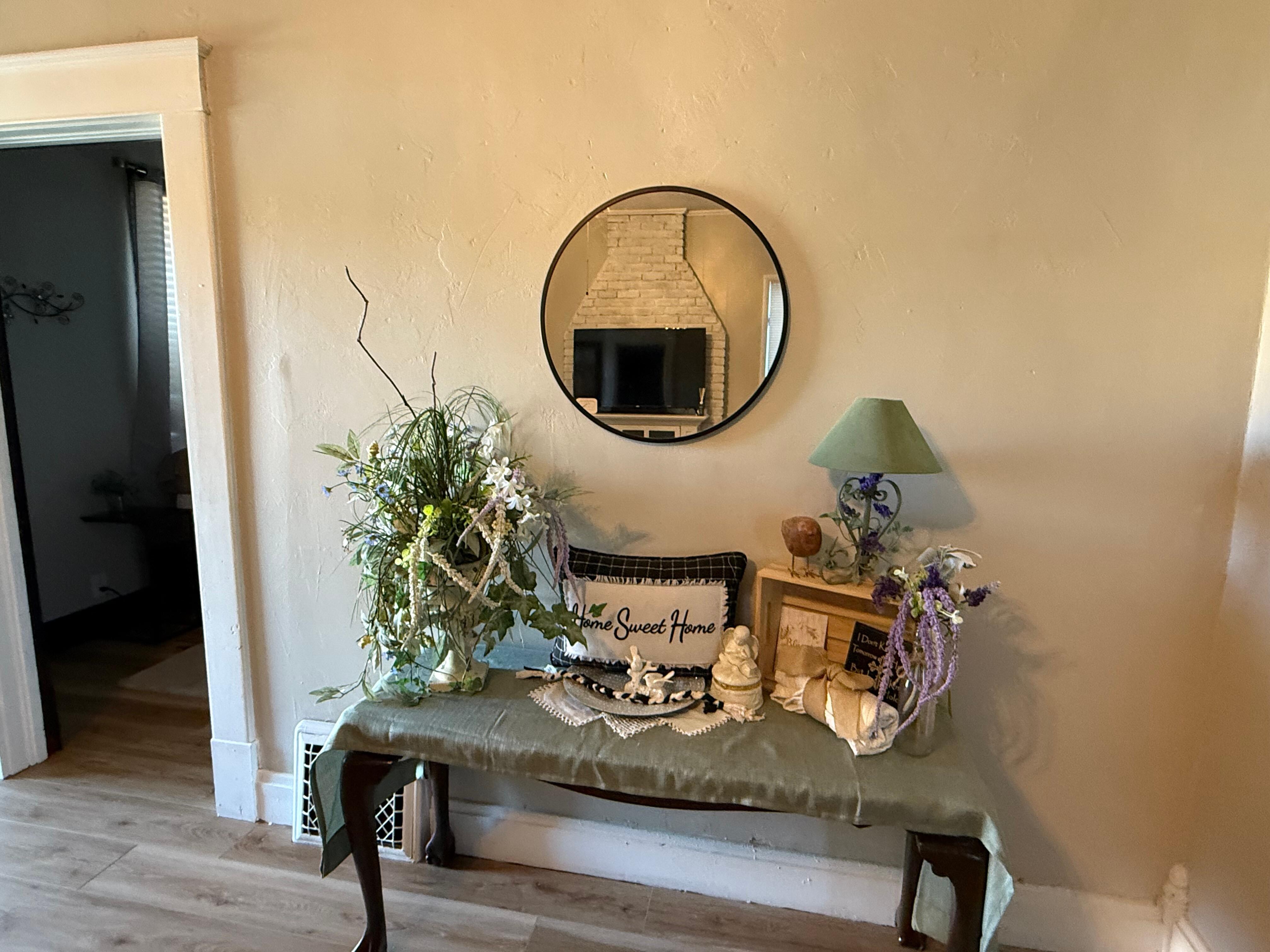 Back area of the kitchen with a breakfast table and coffee bar