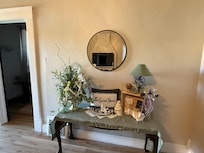 Back area of the kitchen with a breakfast table and coffee bar