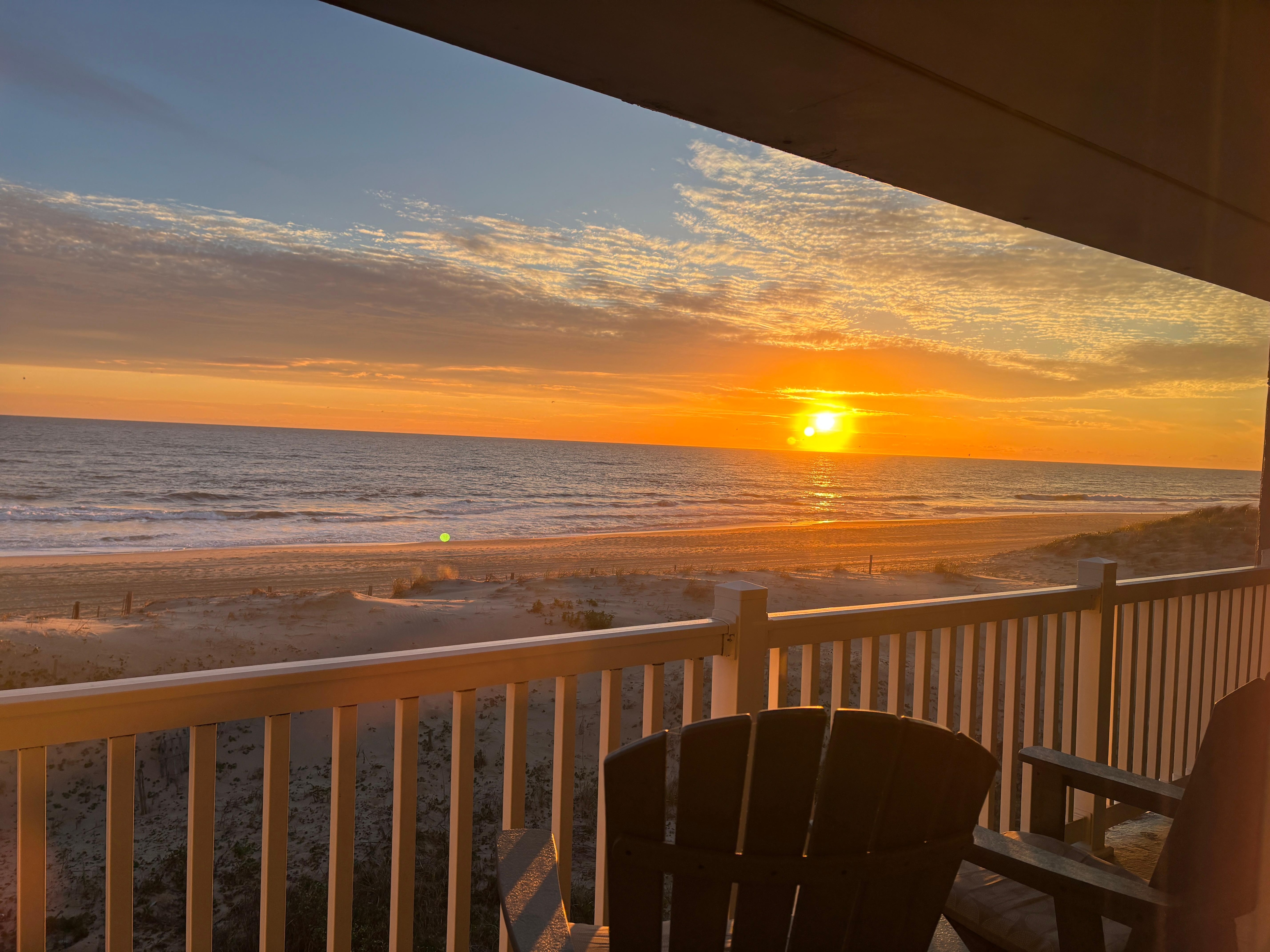 Morning Sunrise off our ocean view from the deck of our VRBO Rental.  