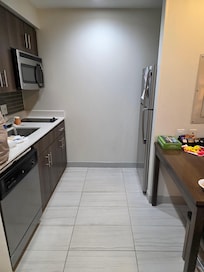 The kitchen area was nice and furnished with necessities. We added the food!