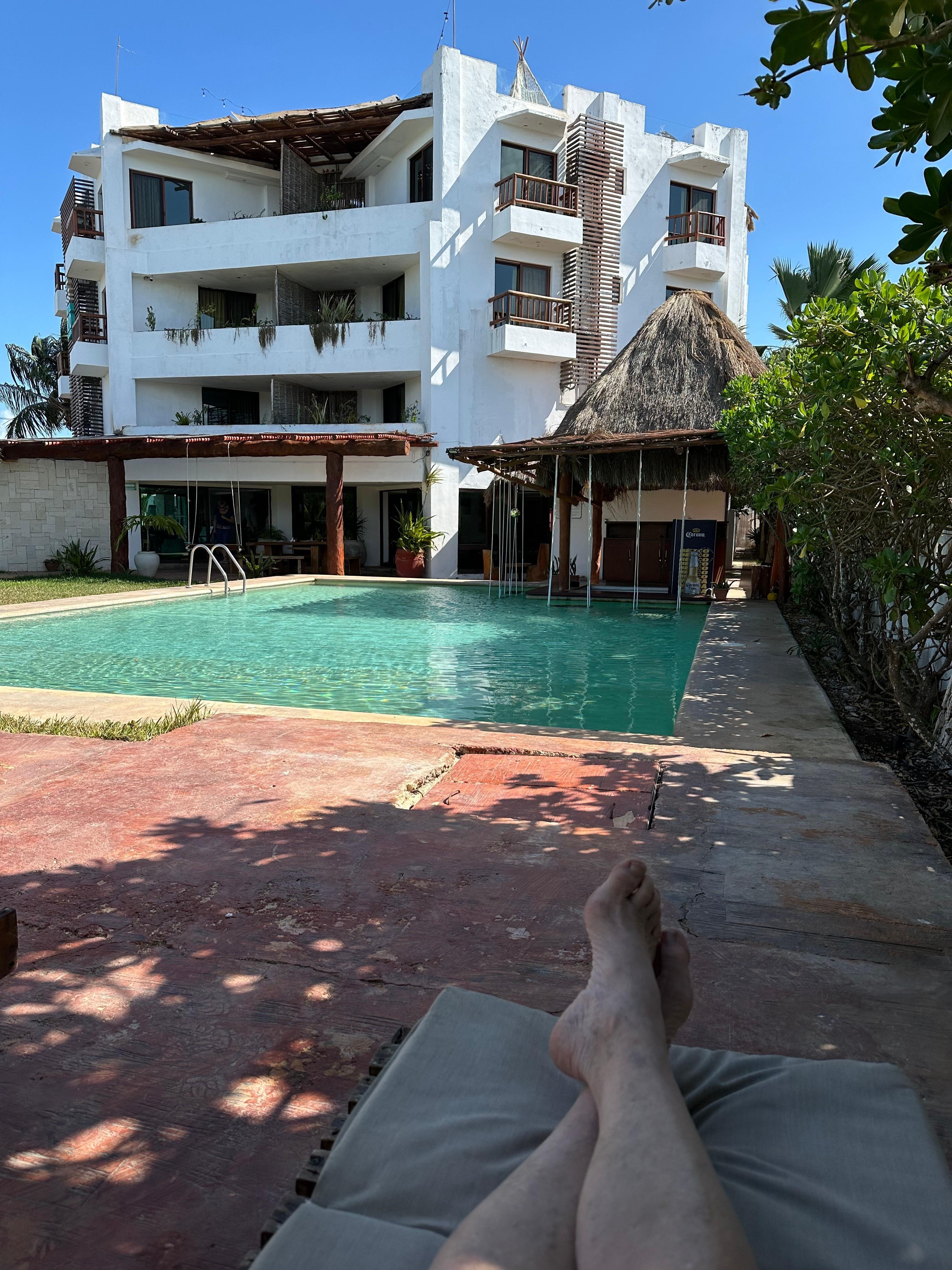 A view of hotel from the pool ... with very pale legs (to date).