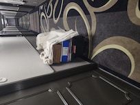 Paint thinners stored in hallway.