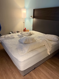 Bed with sheets we had to request from the desk to make our own bed since we didn’t get clean sheets
