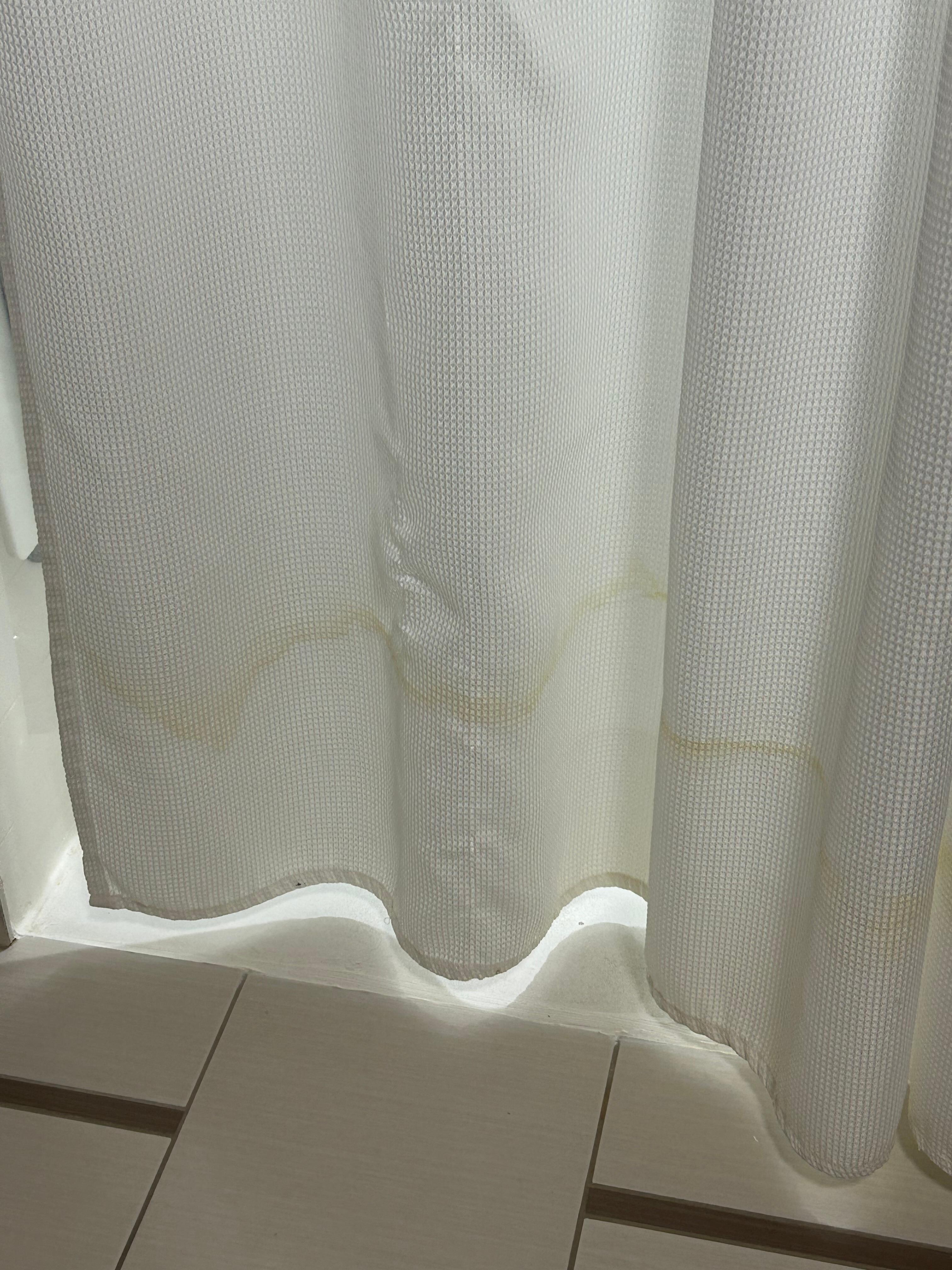 Stained shower curtain.