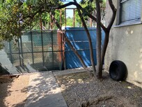 Screening on construction site adjacent to unit.