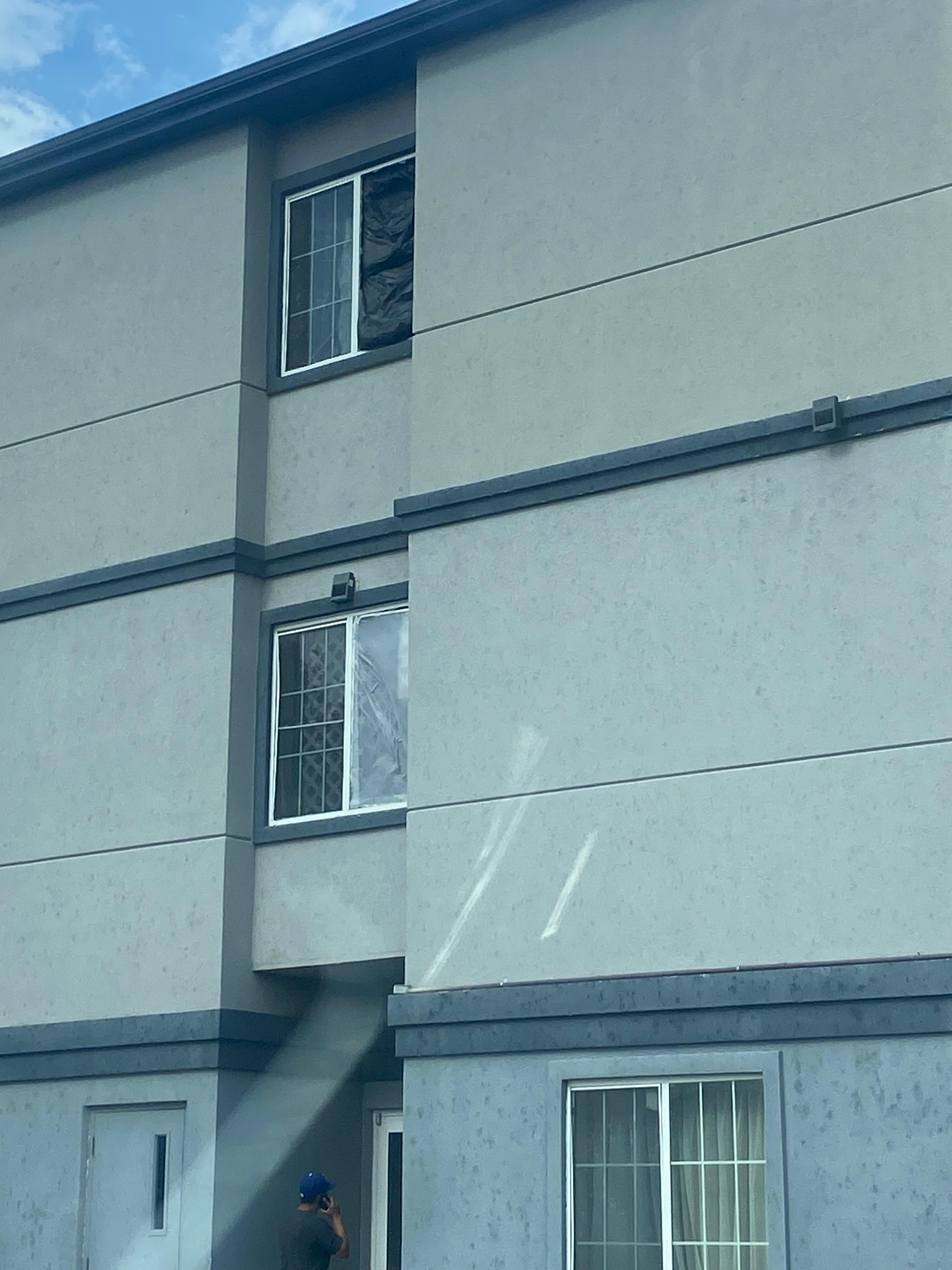 Trash bags taped to broken windows. 