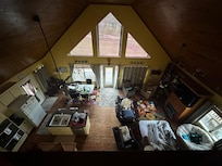 The kid on the couch chose to sleep there, rather than a bed