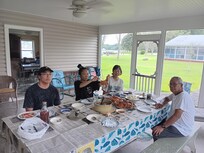 Crab feast every lunch. The screened porch with nice view, ceiling fan and long table with benches made our dining together memorable