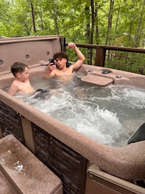 Big brother and little brother enjoying the hot tub