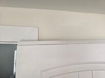 I can only guess they cut the top of the door first. Realized mistake and then cut the bottom of the door and installed the cut back on the top to fix 1st error?