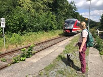 Station in the village. A train every 2 hours in both directions. You get free access to trains, buses and some ferries with the visitors card you get when registering as a visitor.