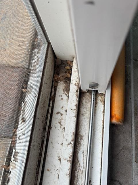 Dirty Patio door tracks, bedroom