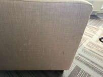 Ejaculation on the side of the loveseat by the bed.