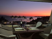 Table set for dinner on the balcony.