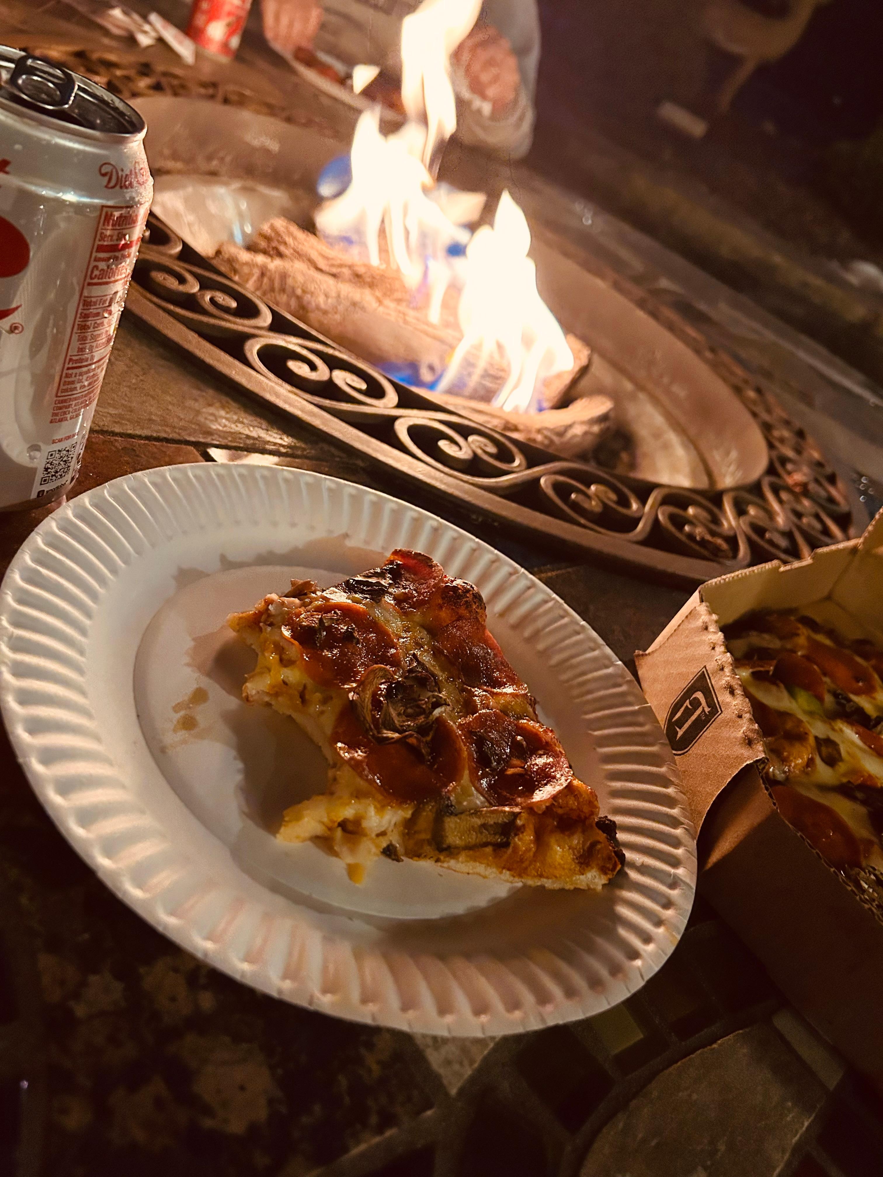 Seating area out front of hotel with gas fire.