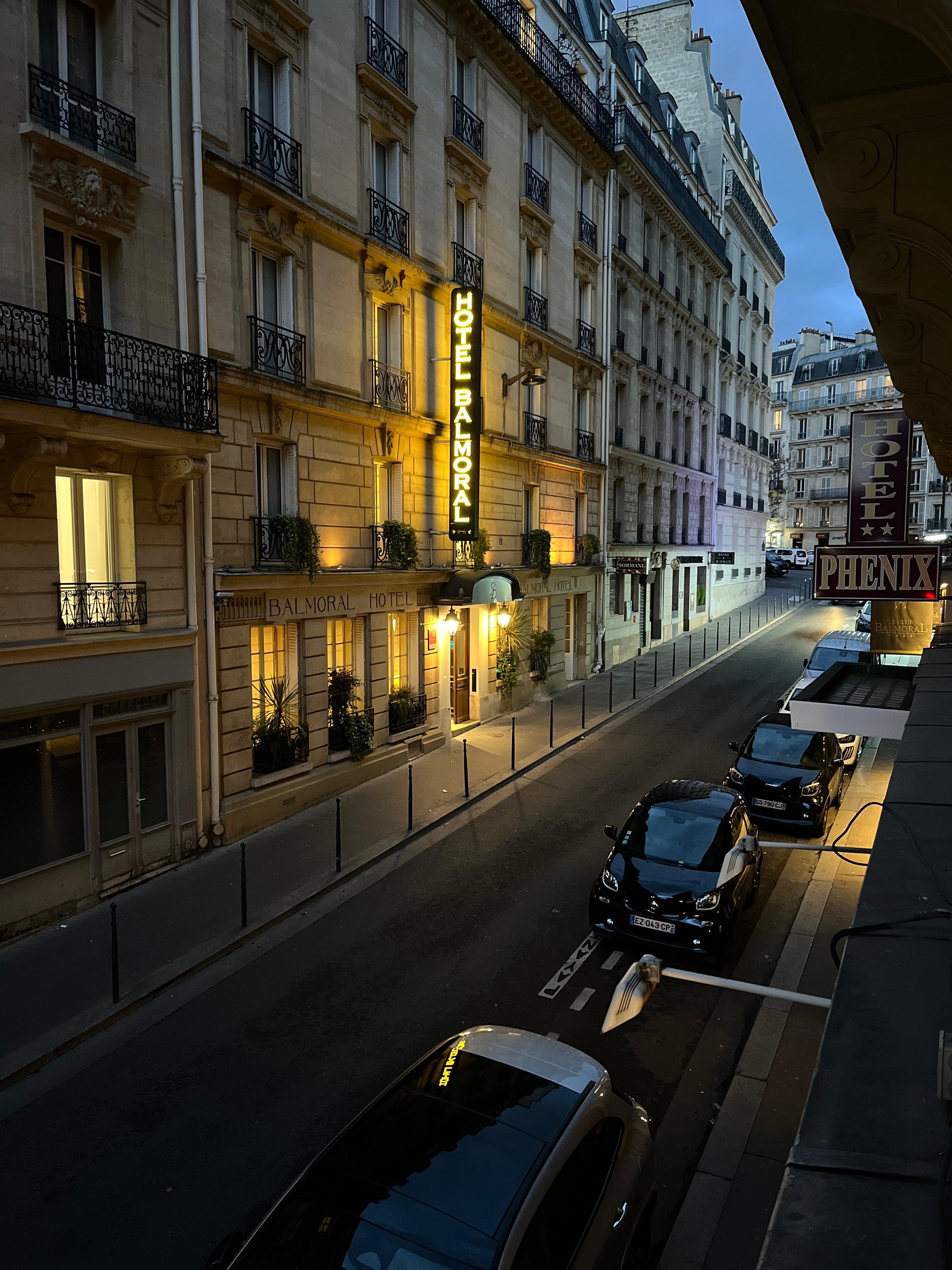 View up the street and around the corner is the entrance to the metro