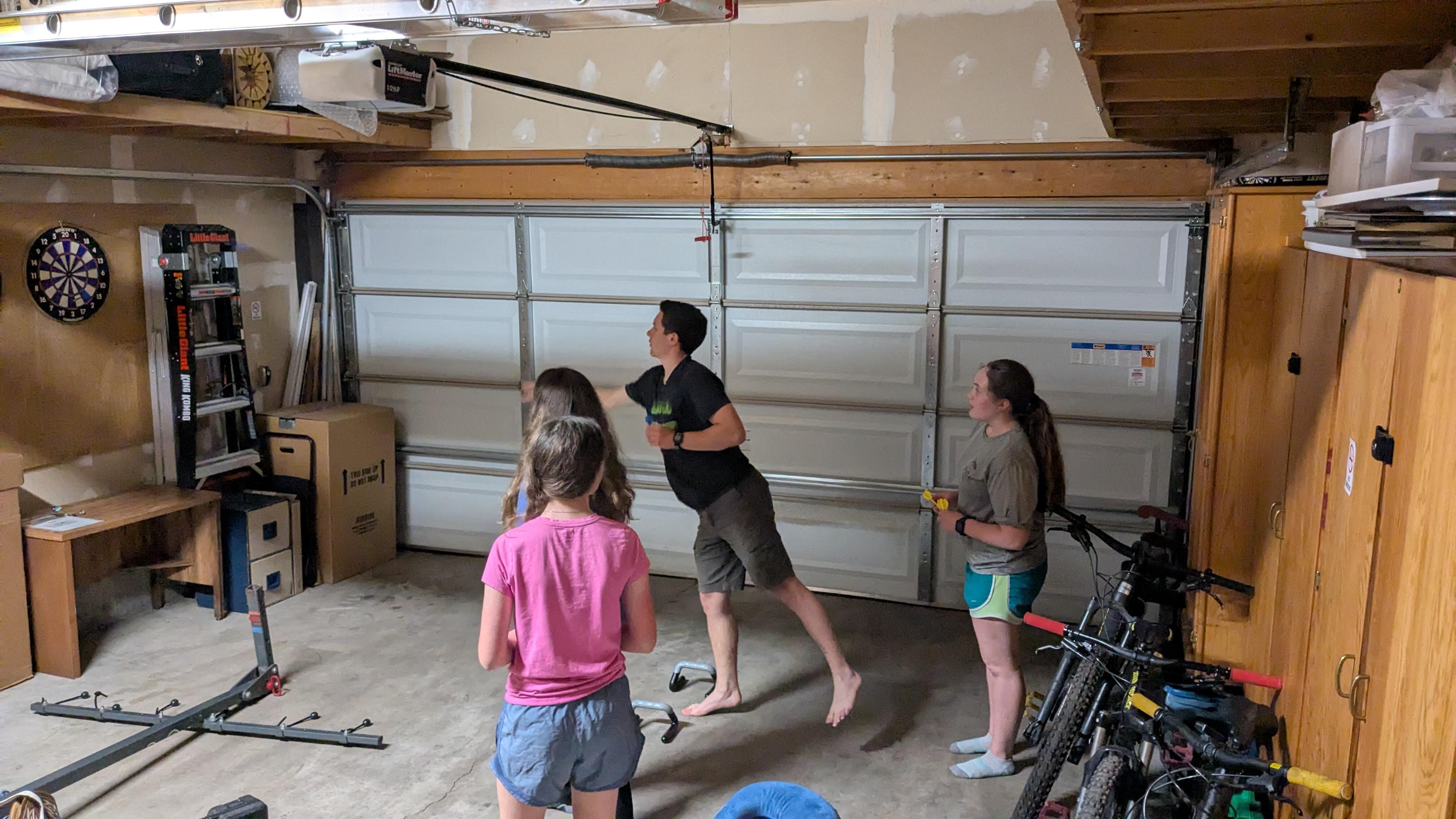 Kids having fun playing darts. 