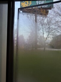 Screen hanging off of window