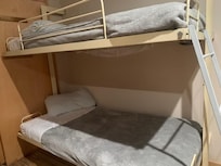 The bunk beds with lumpy mattresses