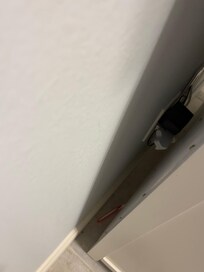 Old toothbrush behind dresser