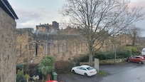 The rear bedroom overlooks Alnwick Castle walls.