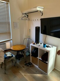 Small seating/work area, clothes hanging area, iron & ironing board, WiFi and Roku Tv