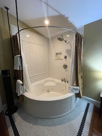 Shower and jacuzzi tub.