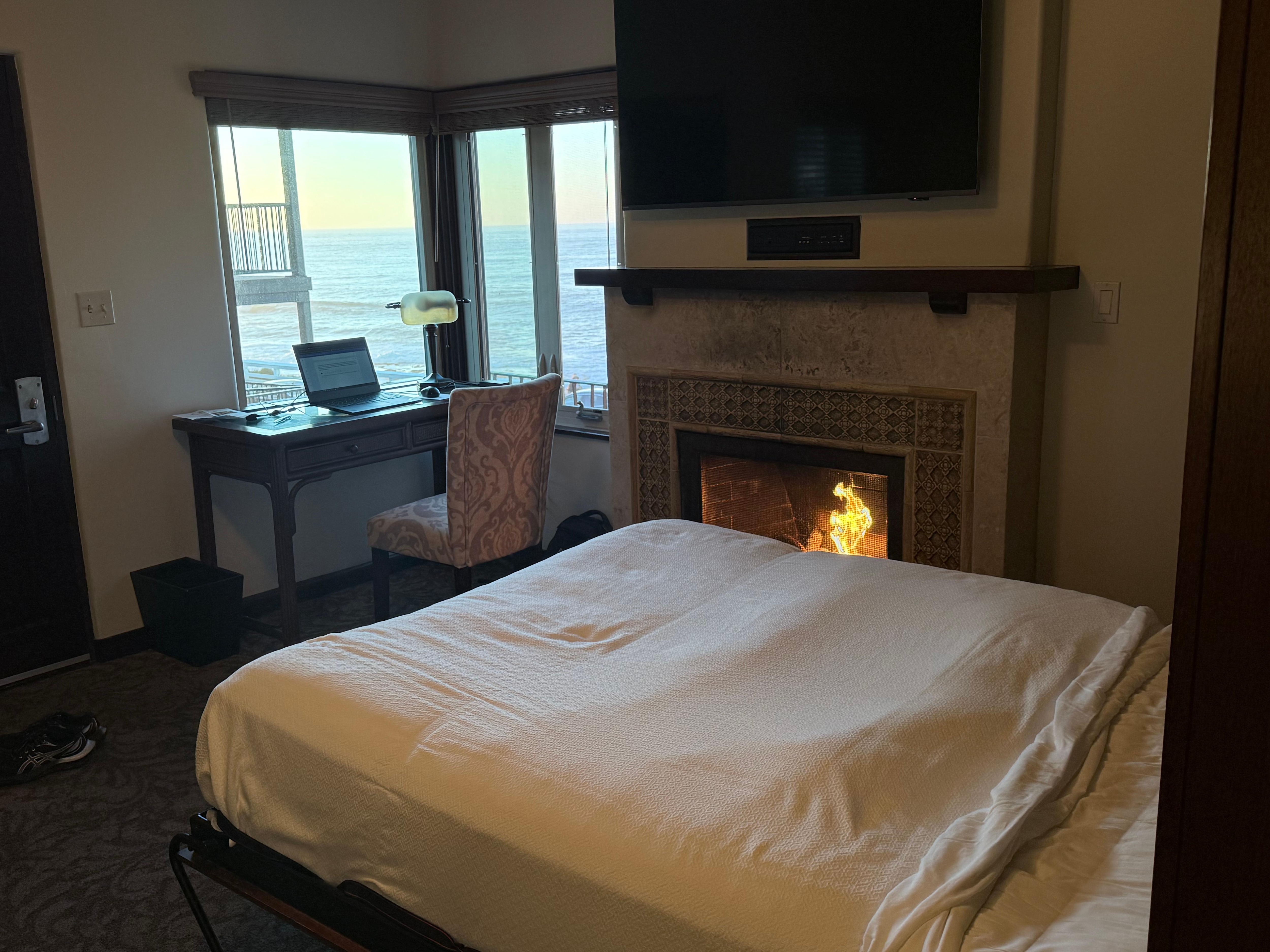 Living room with Murphy bed, fireplace, ocean view. 