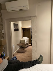 Beside the bed looking into the “dressing room”